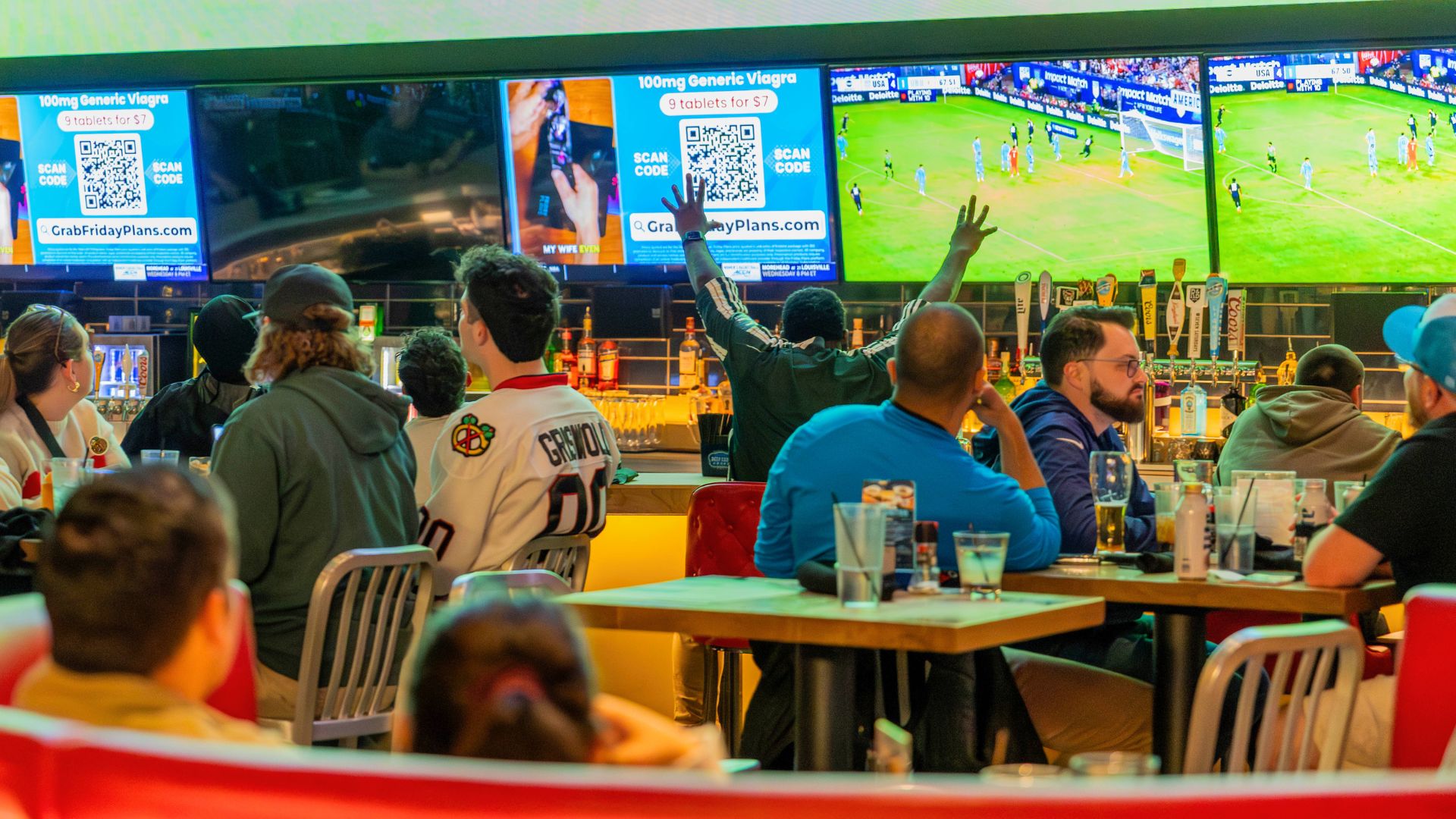 Soccer Watch Party and groups of people dining at a sports bar