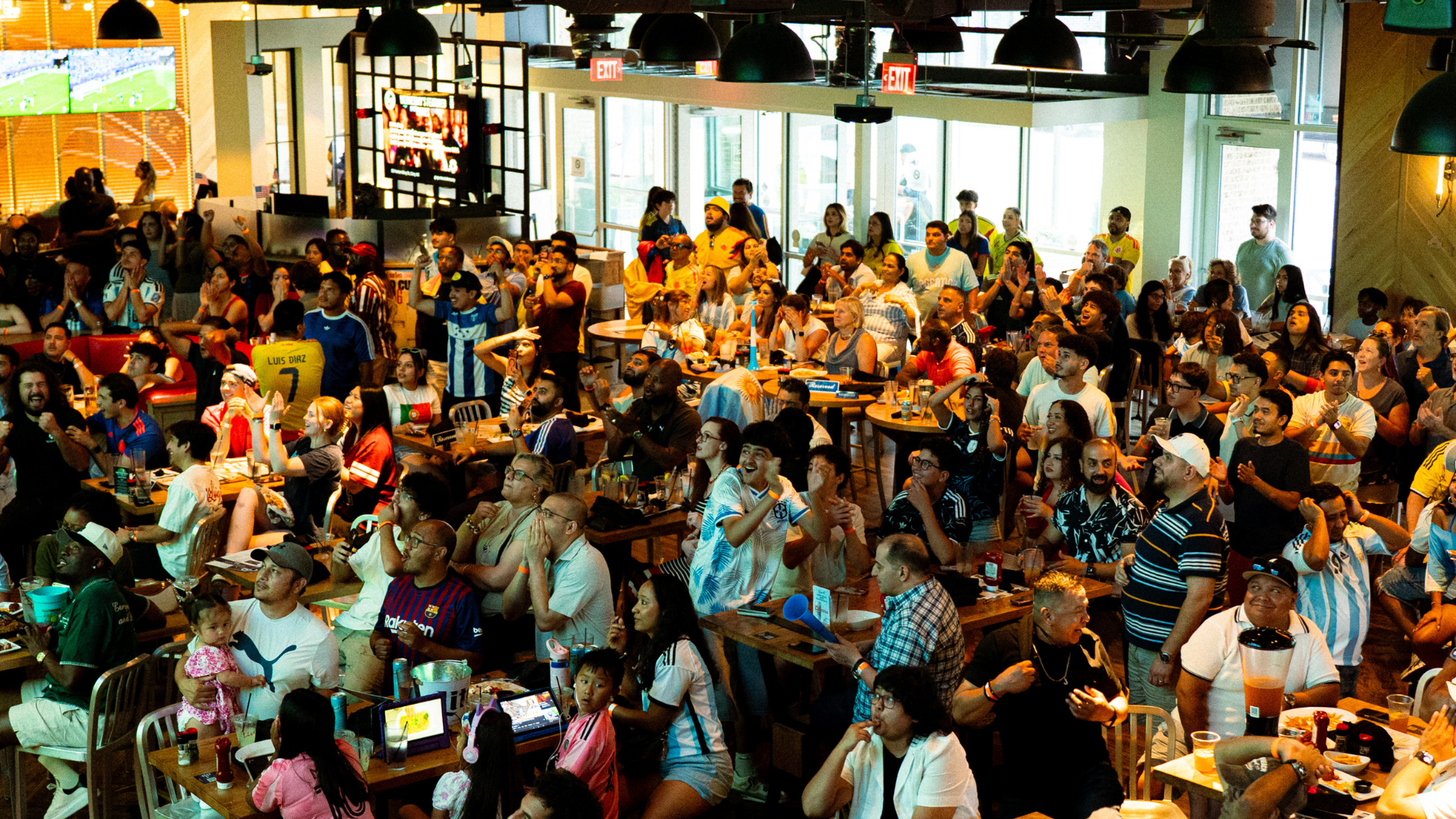 World Soccer Fans Celebrating at Sports and Social