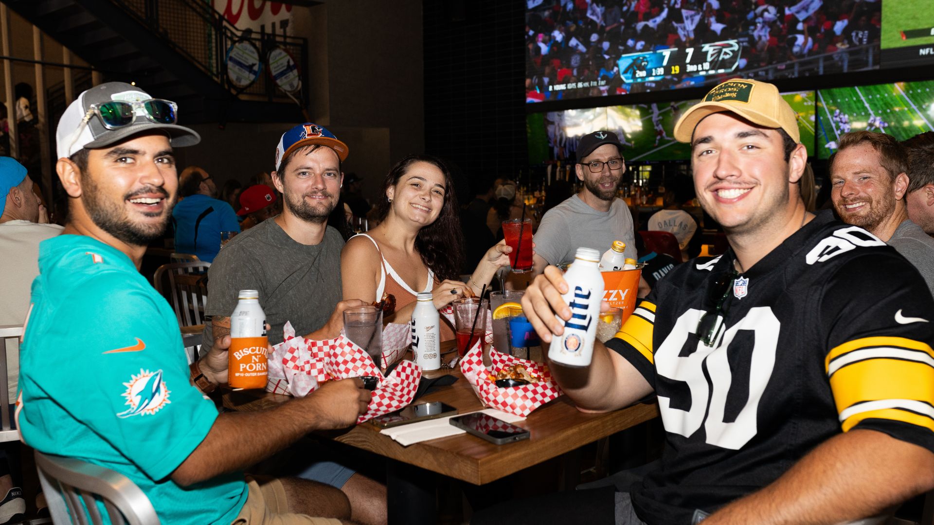 Group of football fans dining at a sports bar