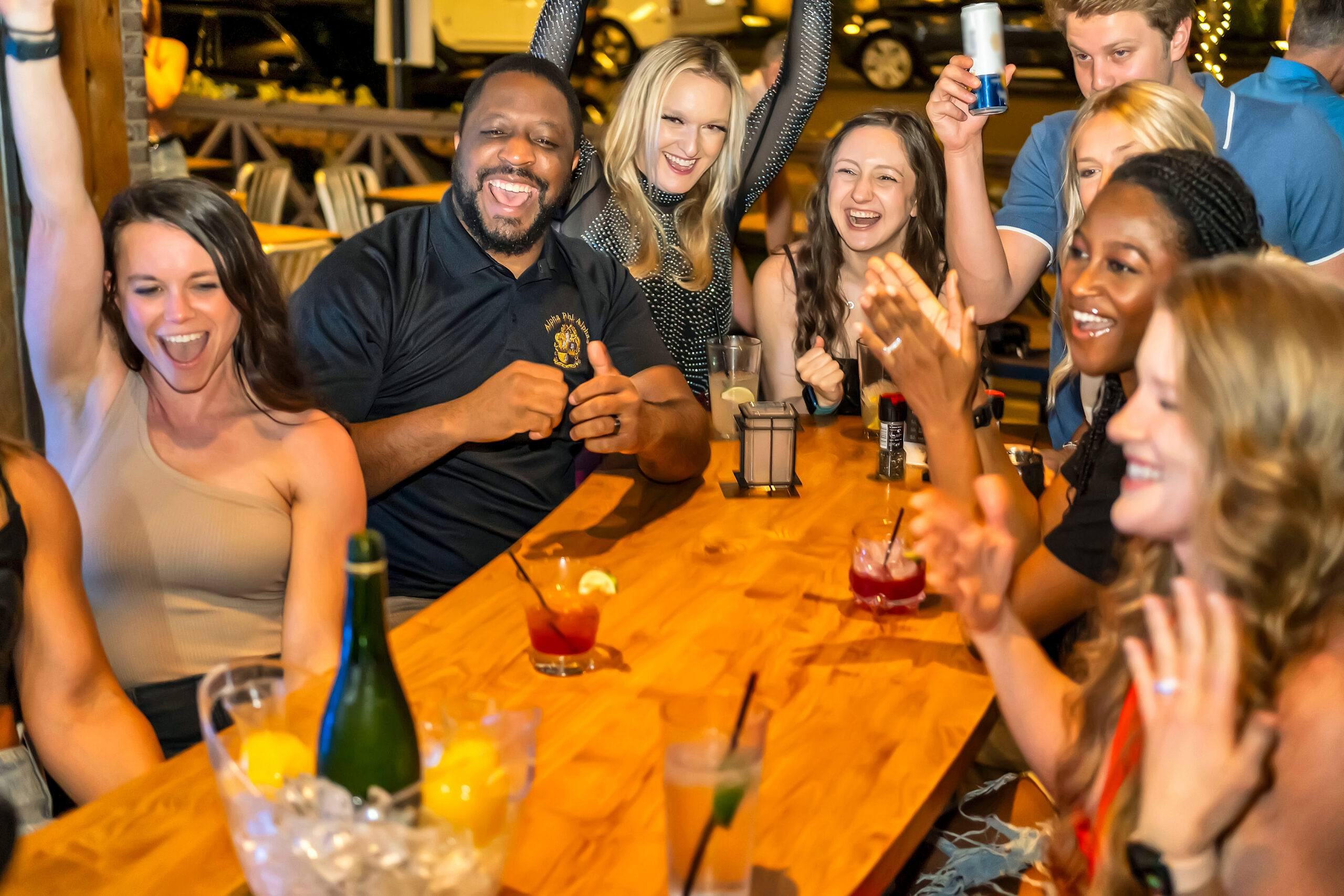group enjoying family friendly soccer watch party at Sports & Social