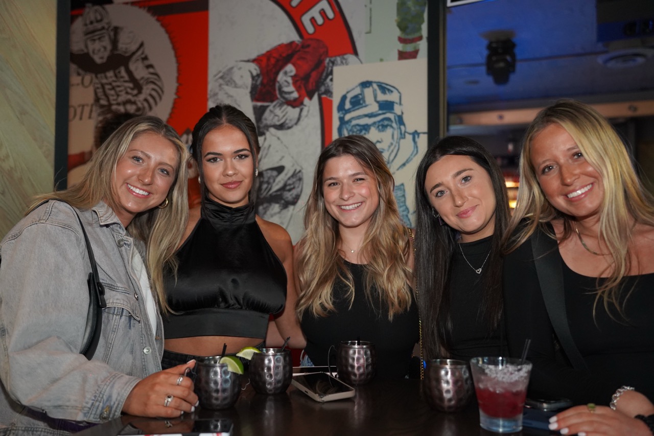 five women at Sports & Social sports bar enjoying nightlife.