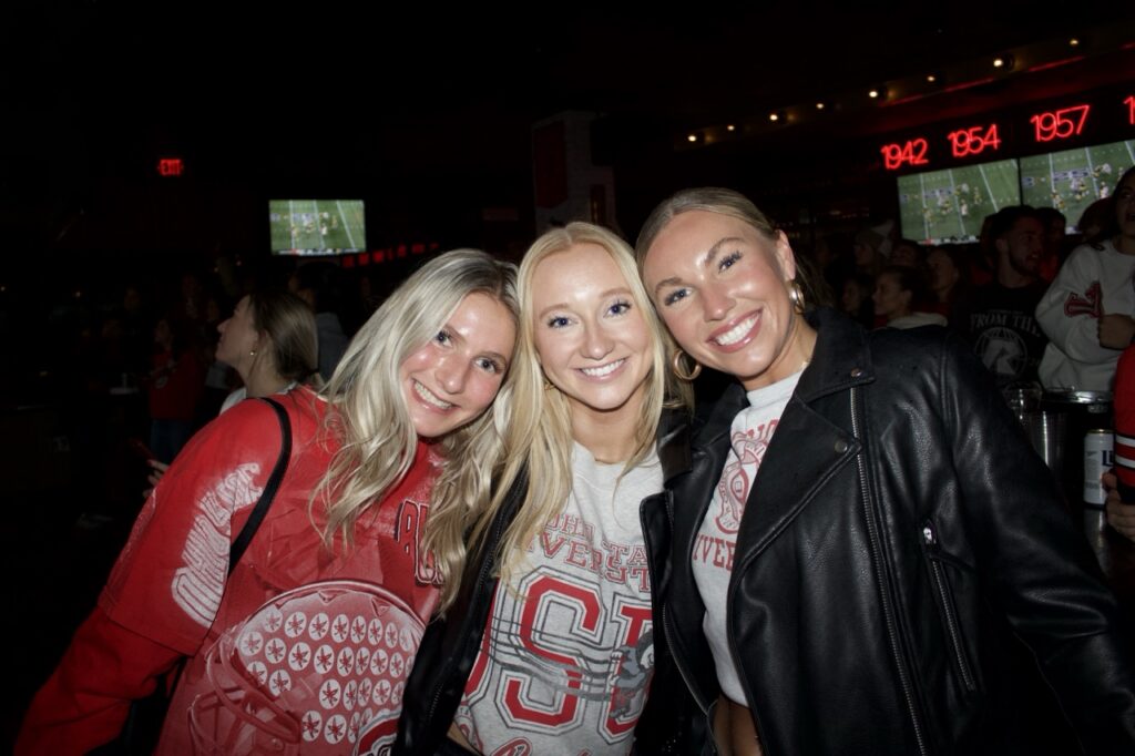 three women at Sports & Social sports bar enjoying nightlife.