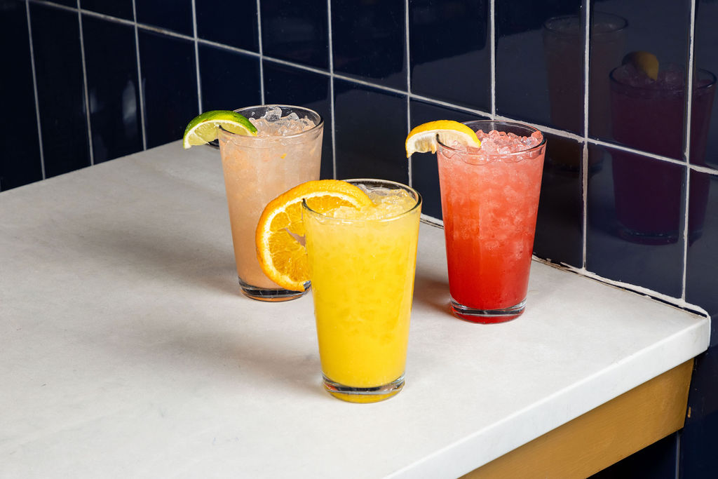 The Paloma Crush, Orange Crush, and Strawberry Lemonade Crush at Sports & Social.