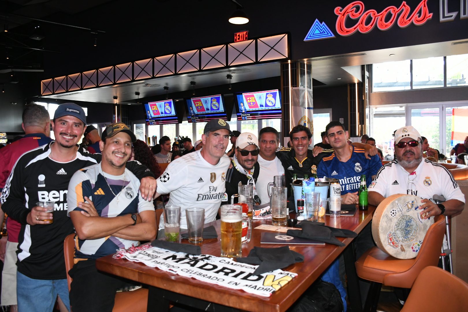 group enjoying family friendly soccer watch party at Sports & Social