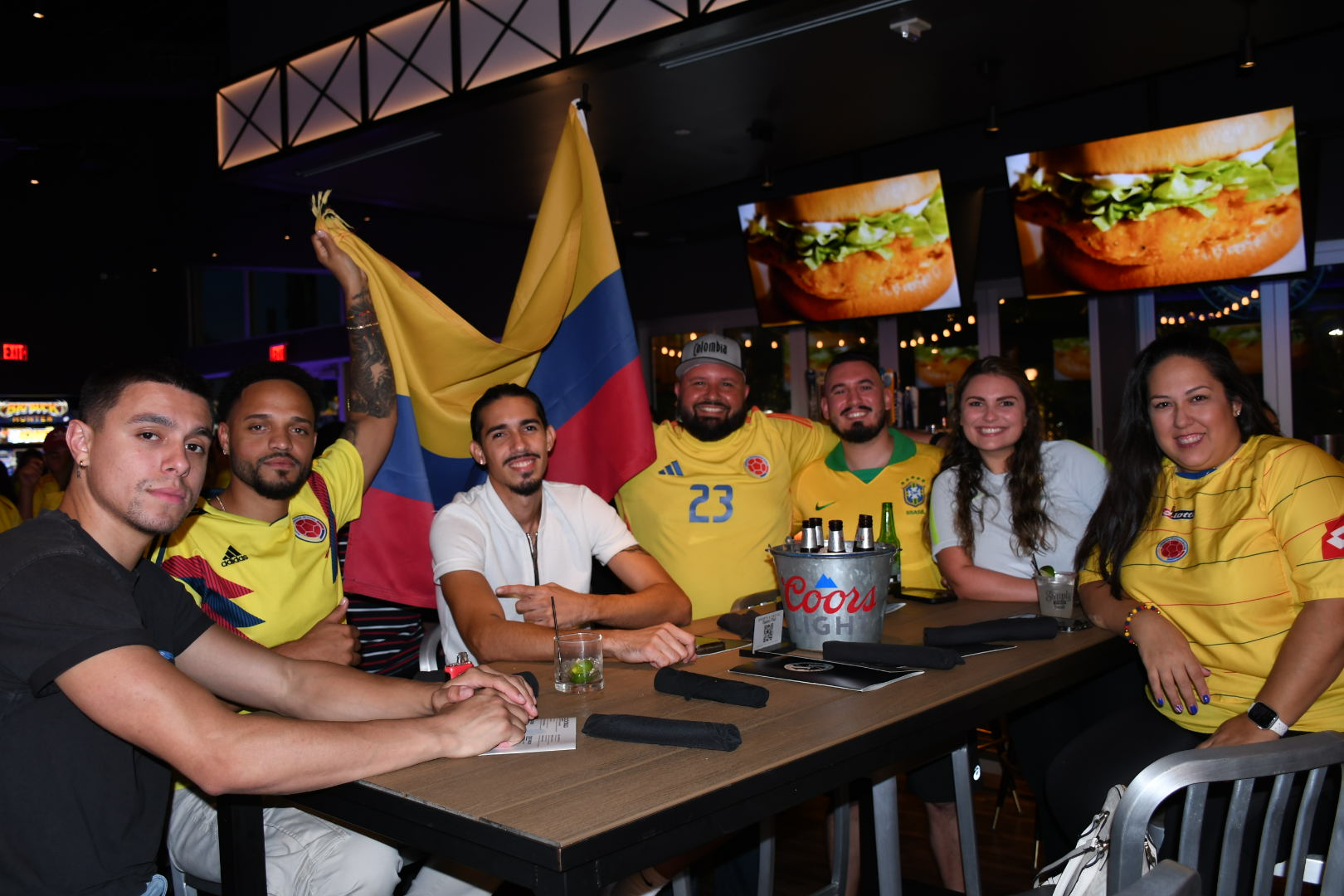 group enjoying family friendly soccer watch party at Sports & Social