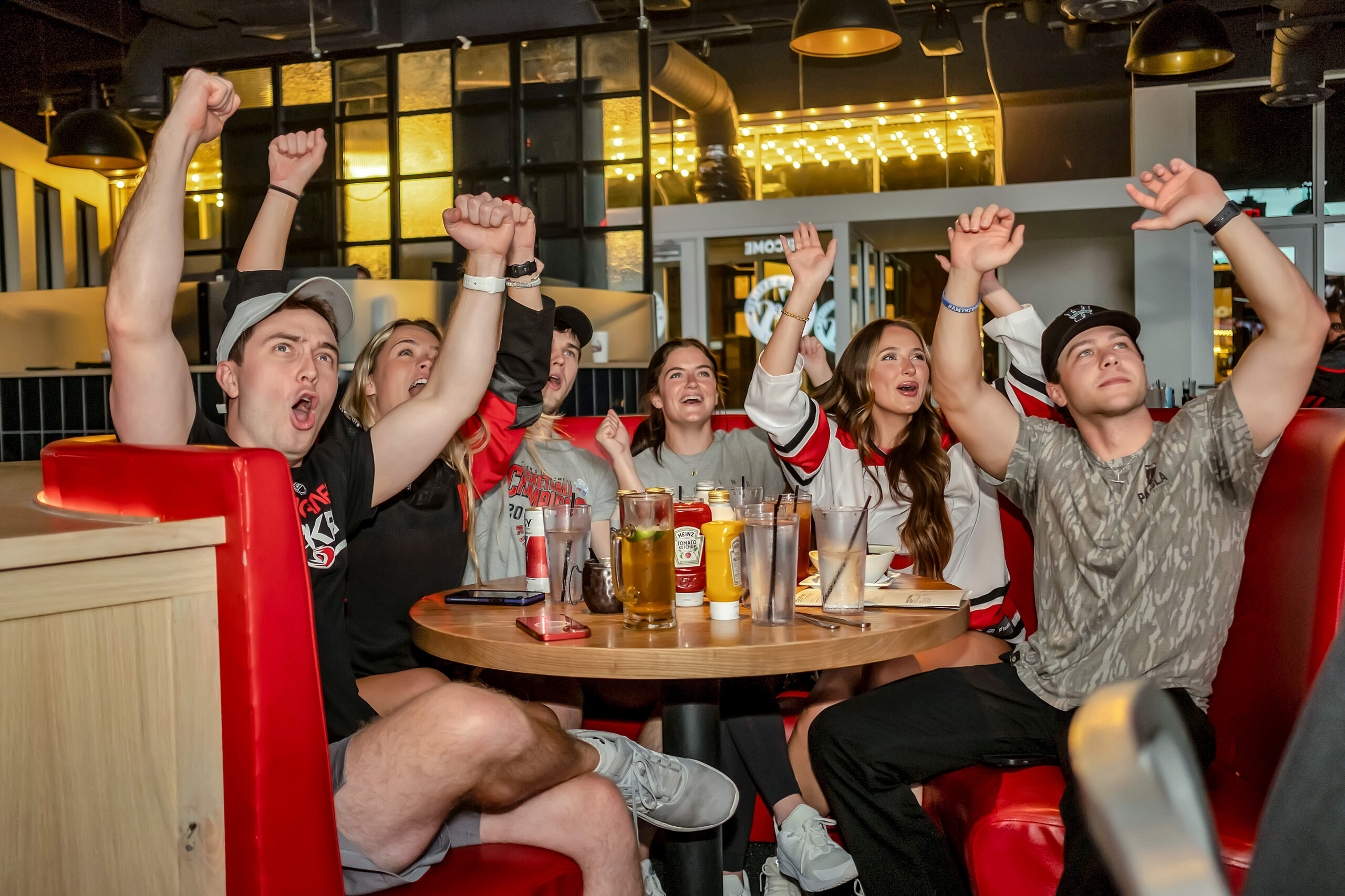 group enjoying family friendly soccer watch party at Sports & Social