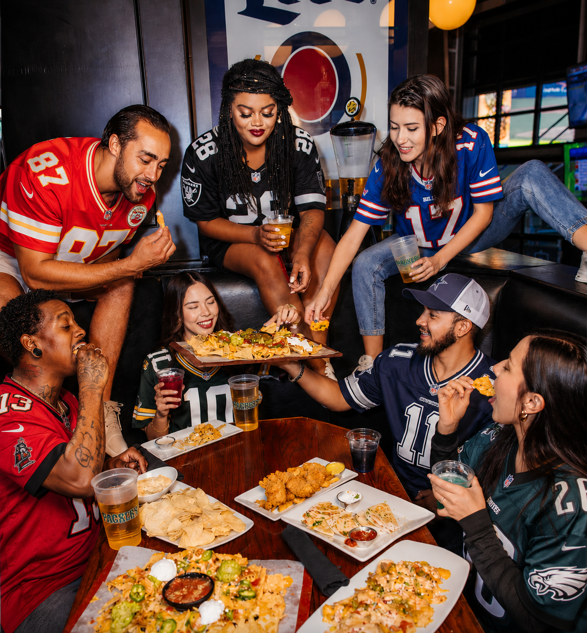 a group of sports fans enjoying food at sports and social