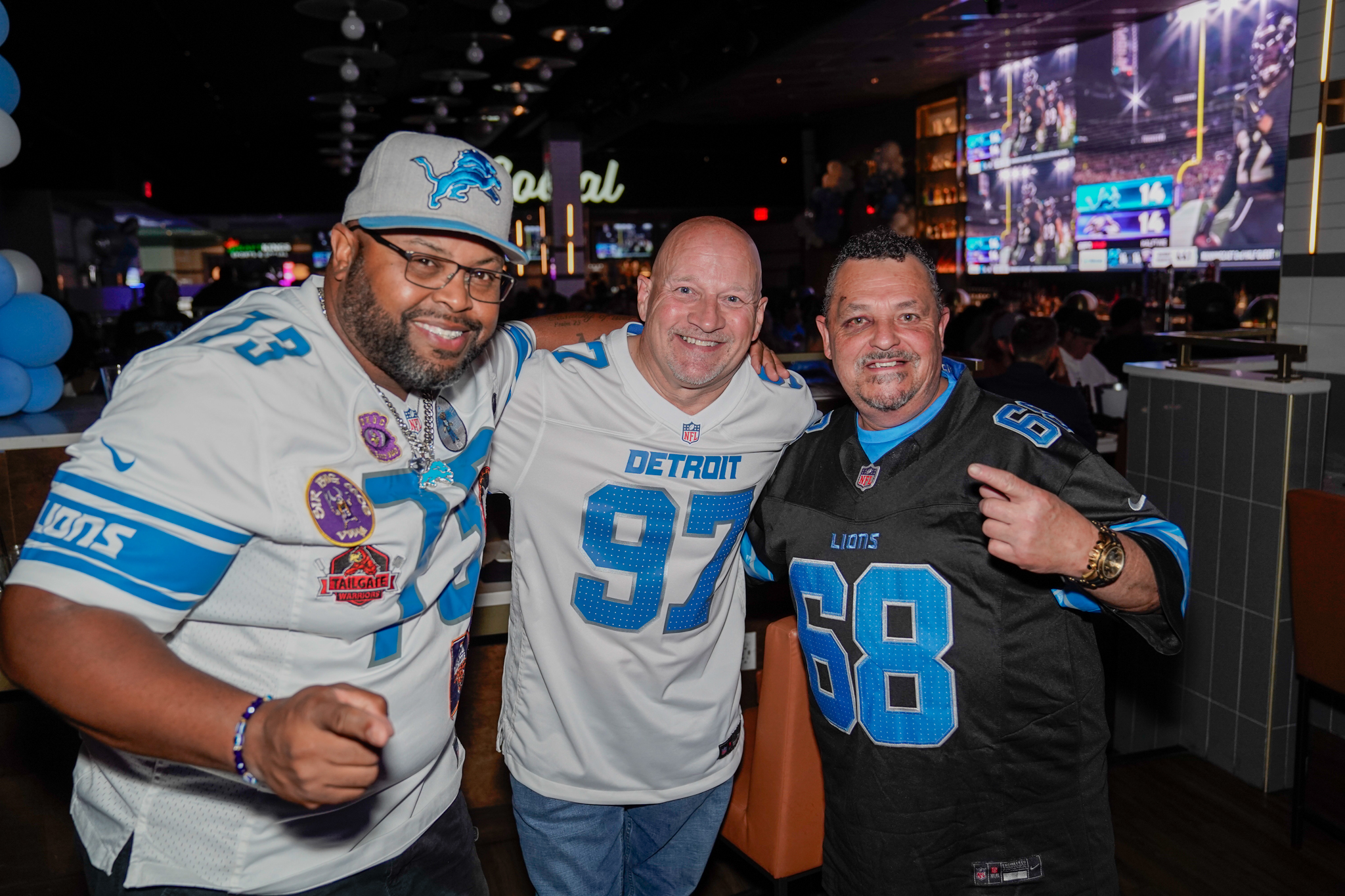 a group of men preparing for their fantasy football draft party